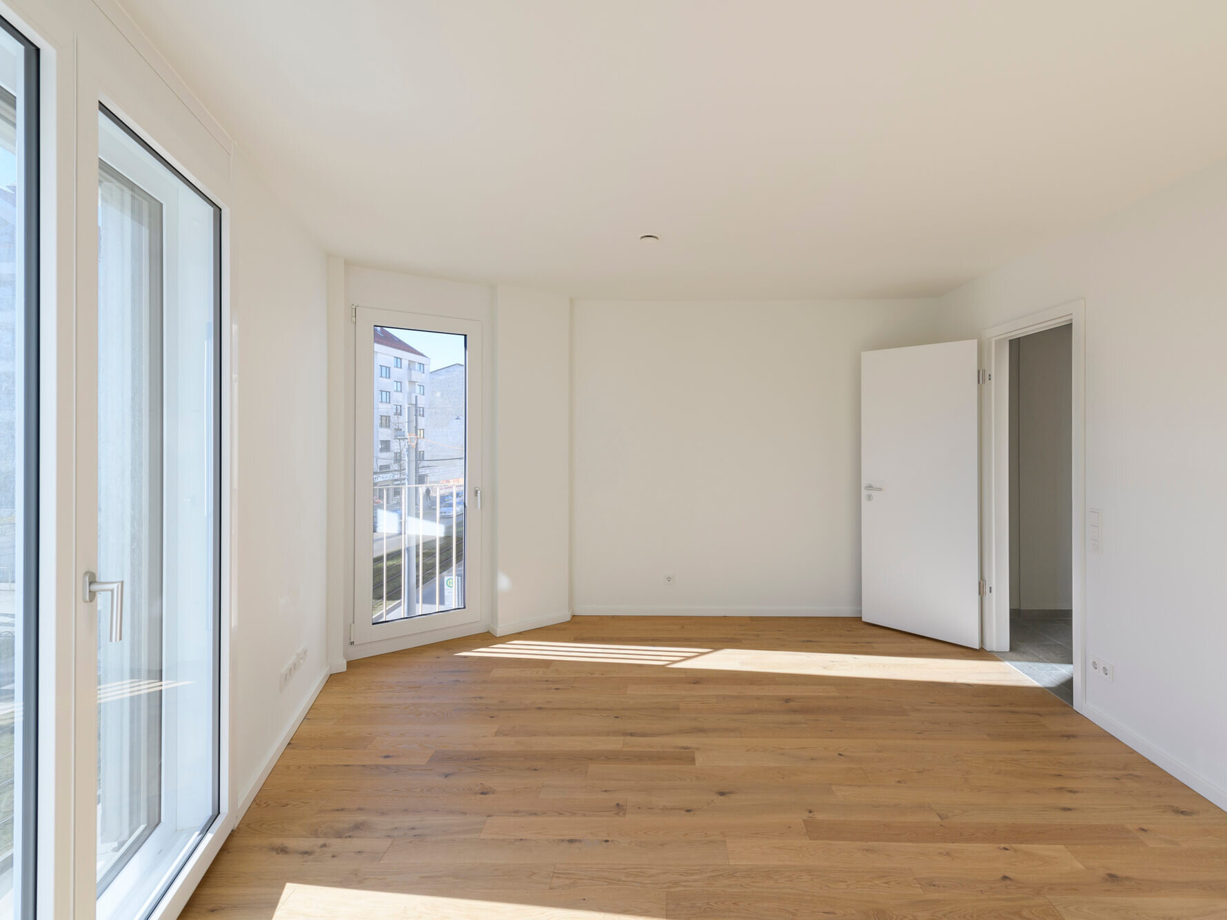 Rückzugbereich mit Balkonzugang in der Mietwohnung C.54 im kupa Quartier Pasing