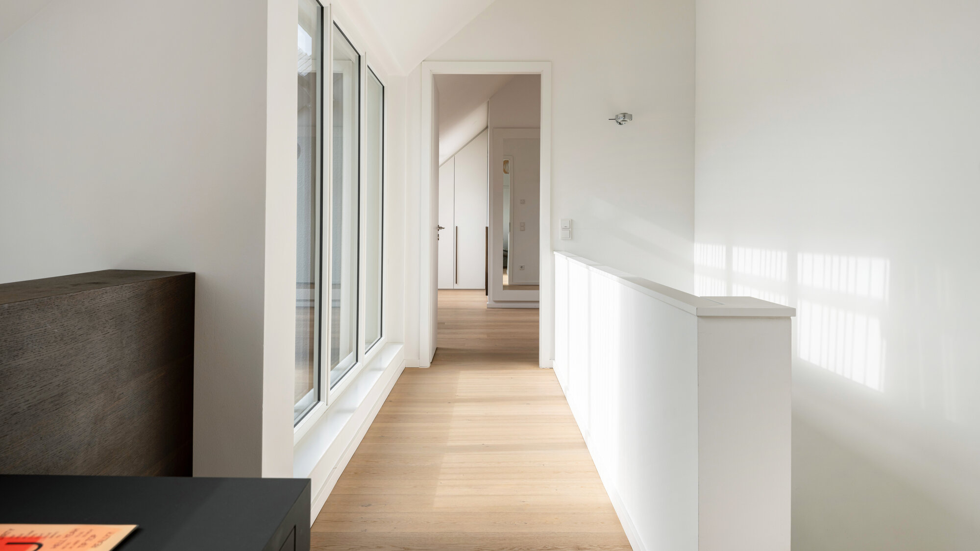 Galerieebene der Eigentumswohnung W1.16 im Bereiteranger 15 mit Einbauten.