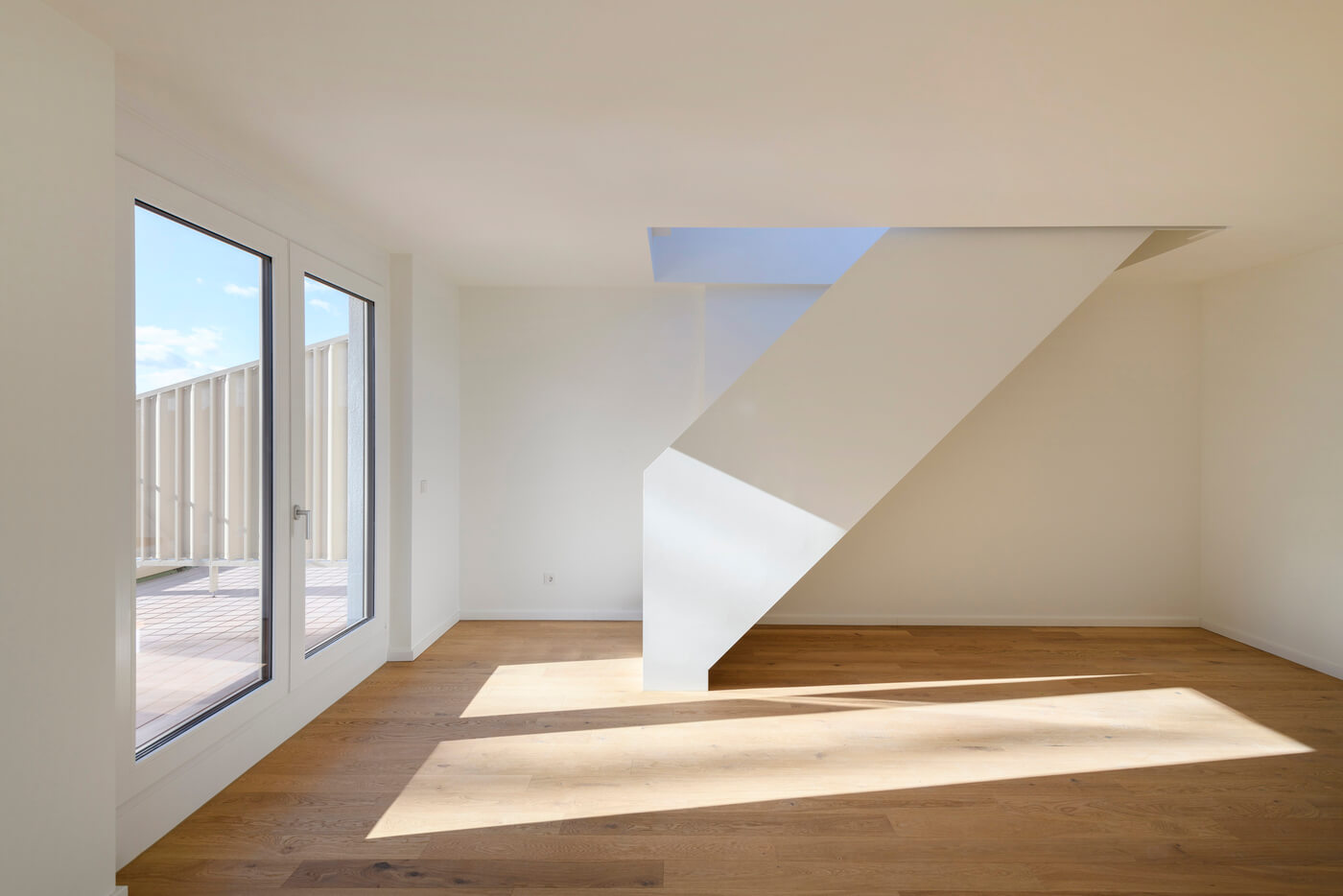 Wohnzimmer einer Neubauwohnung im Wohnprojekt kupa