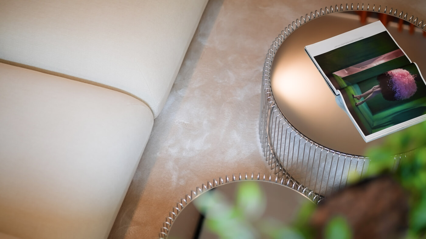 Beiges Sofa, Teppich und runde Tische im Neubau VINZENT in München-Neuhausen