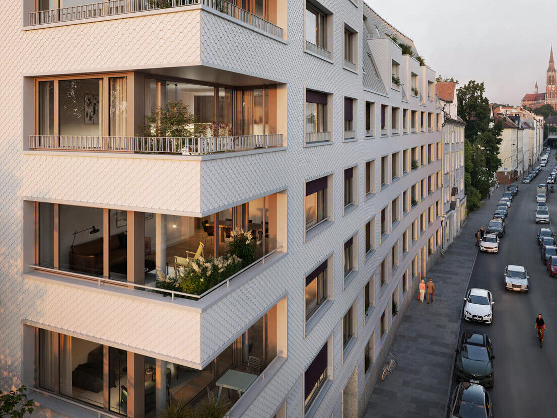 Eckansicht Neubauprojekt Haus Claude in Untergiesing mit Loggien bei Abendlicht