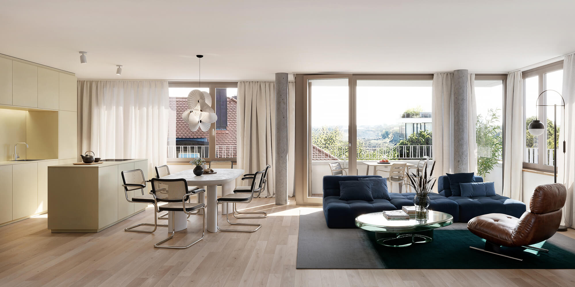 Wohn-Essbereich mit Balkon im Neubauprojekt Haus Claude in Untergiesing 